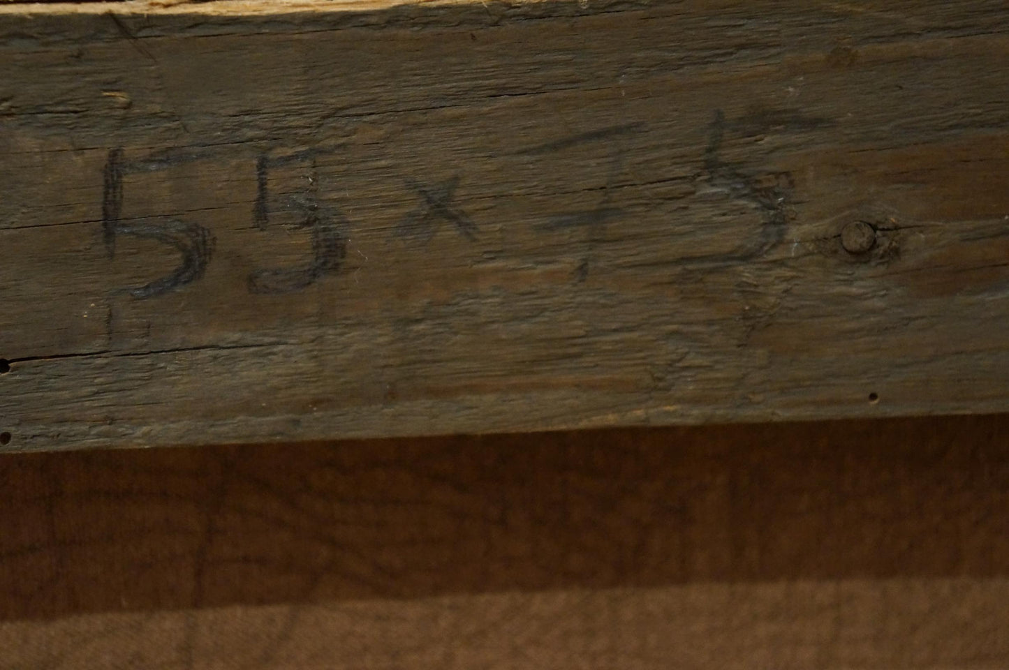 Weathered wooden beam with faded 55x15 markings in Painting City center landscape