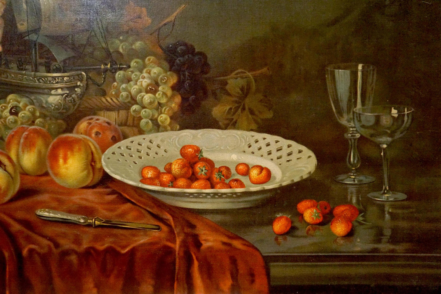 Oil painting of white ceramic bowl with lace pattern holding orange cherry tomatoes