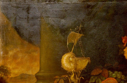 Golden nautilus shell with miniature sailboat atop oil painting