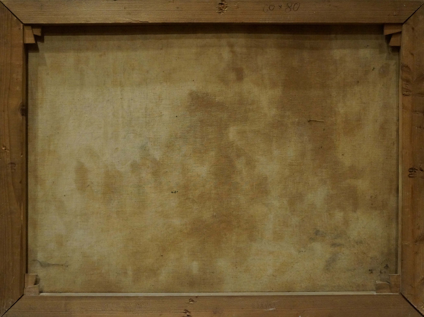 Back of wooden-framed oil painting Food on the table with grapes, aged beige canvas