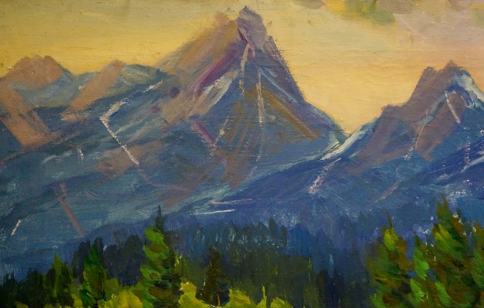 Oil painting of rugged blue-purple-brown mountain peaks by Kogan-Shats Matvey Borisovich under warm yellow sky