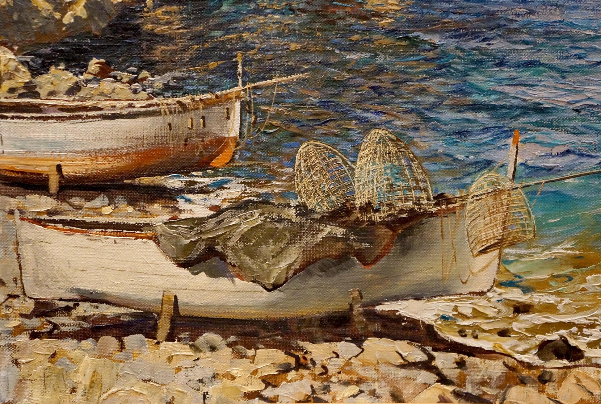 Oil painting of white wooden fishing boat with netting on rocky shore by Felice Giordano