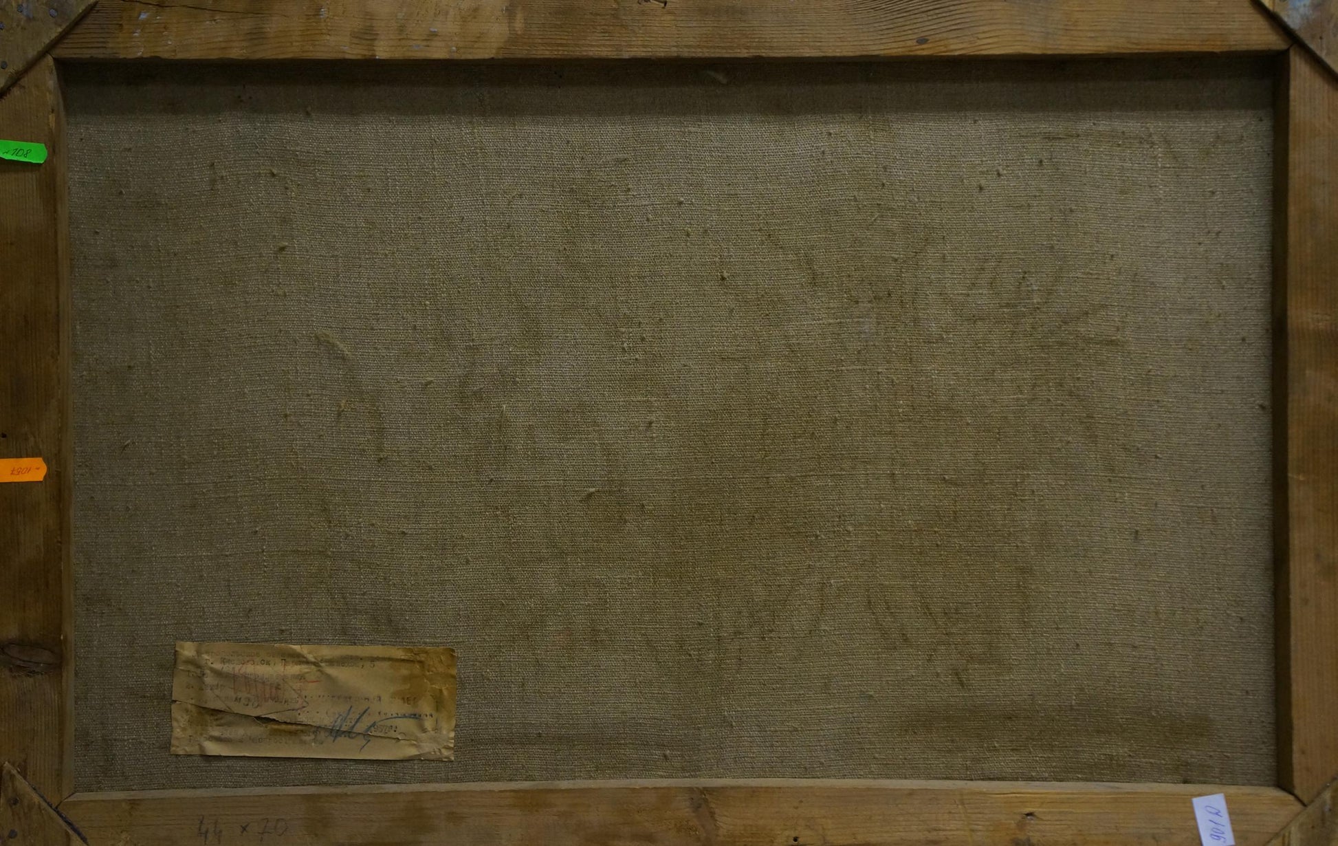 Back of wooden-framed oil painting Winter road in the forest with beige linen and label