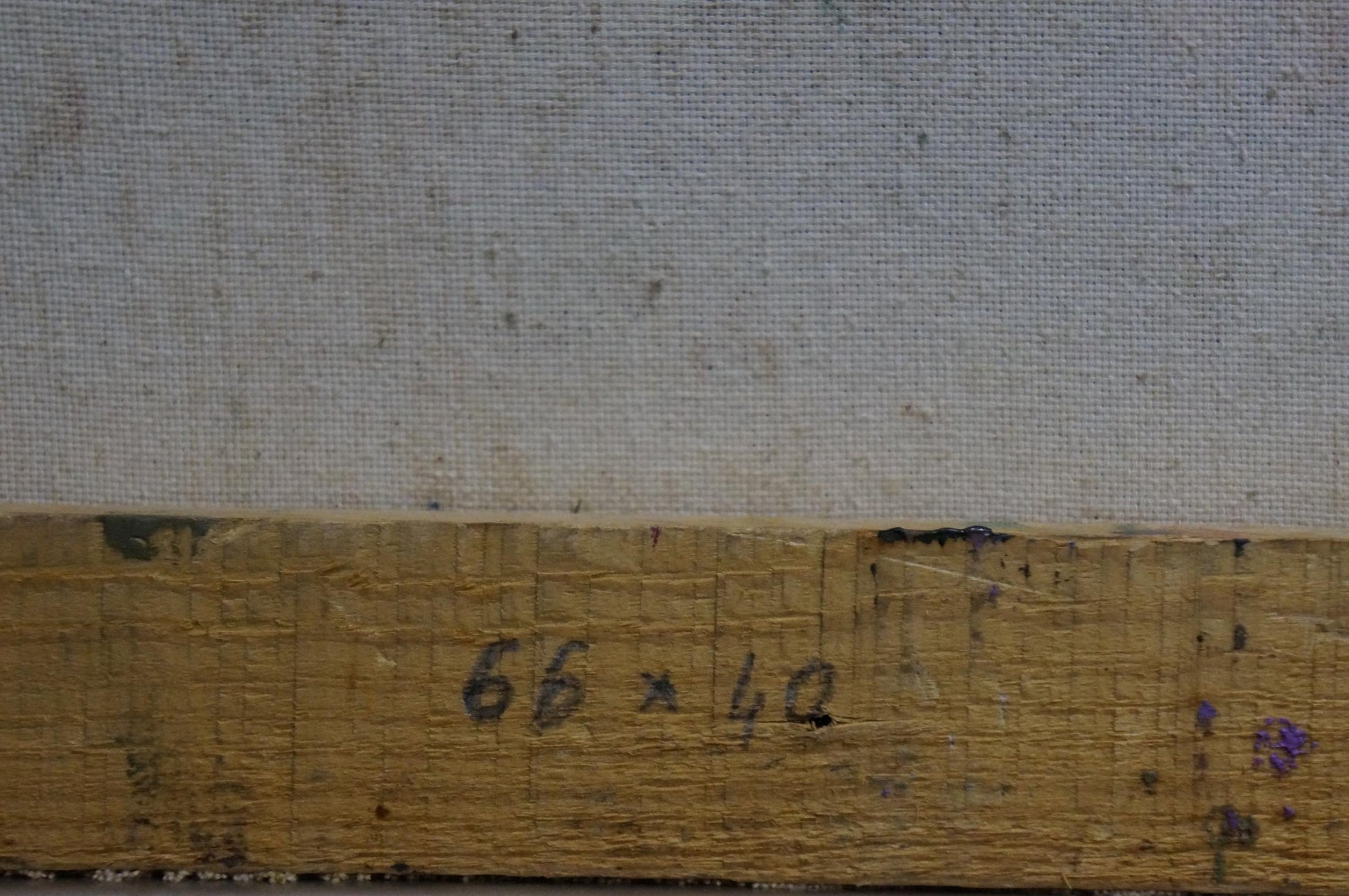 Back of Oil painting Lilac joy on the table: weathered stretcher bar with faded 66 x 42 inch markings