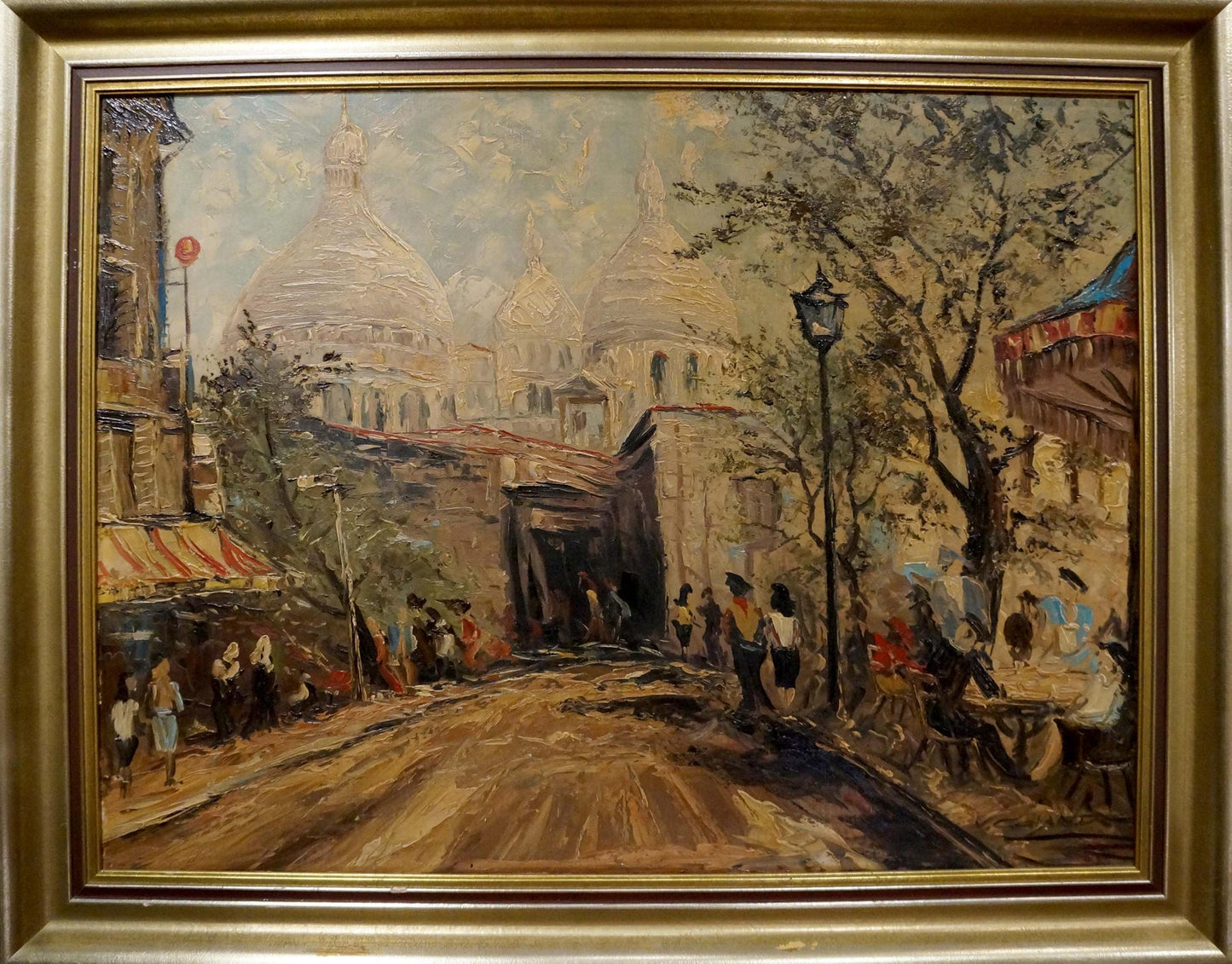 Framed oil painting of stormy Parisian street with Sacré-Cœur in warm tones