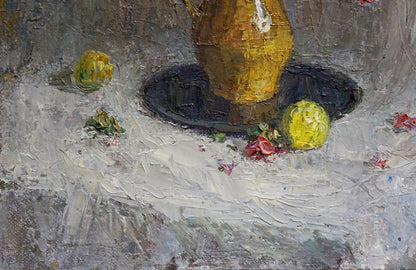 Golden-yellow textured ceramic vase with white accent on gray surface