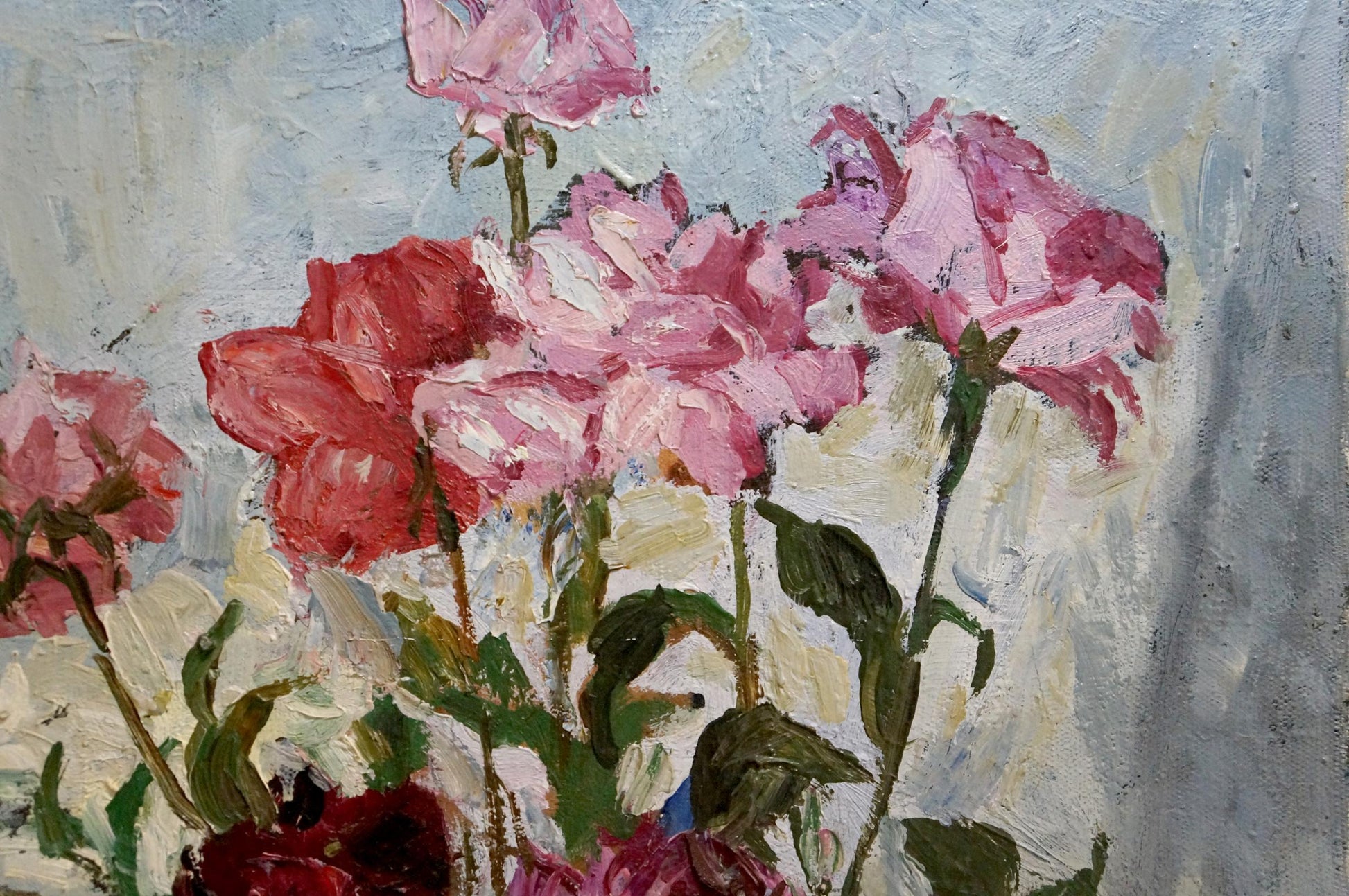Oil painting of pink red roses in vase on table by Petr Kuzmich Stolyarenko