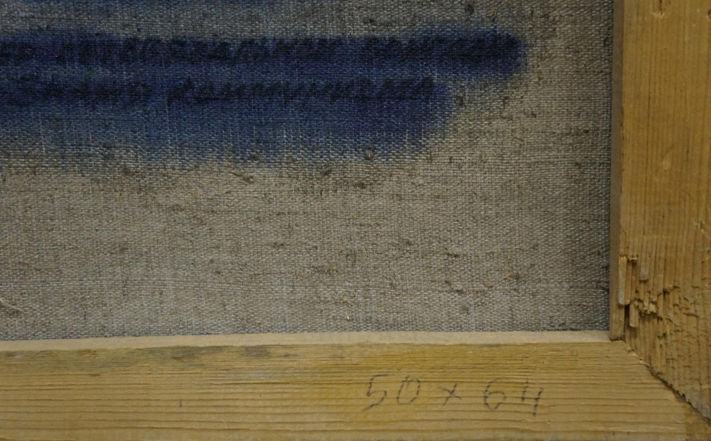 Back of weathered canvas with faded blue stroke by Petr Kuzmich Stolyarenko
