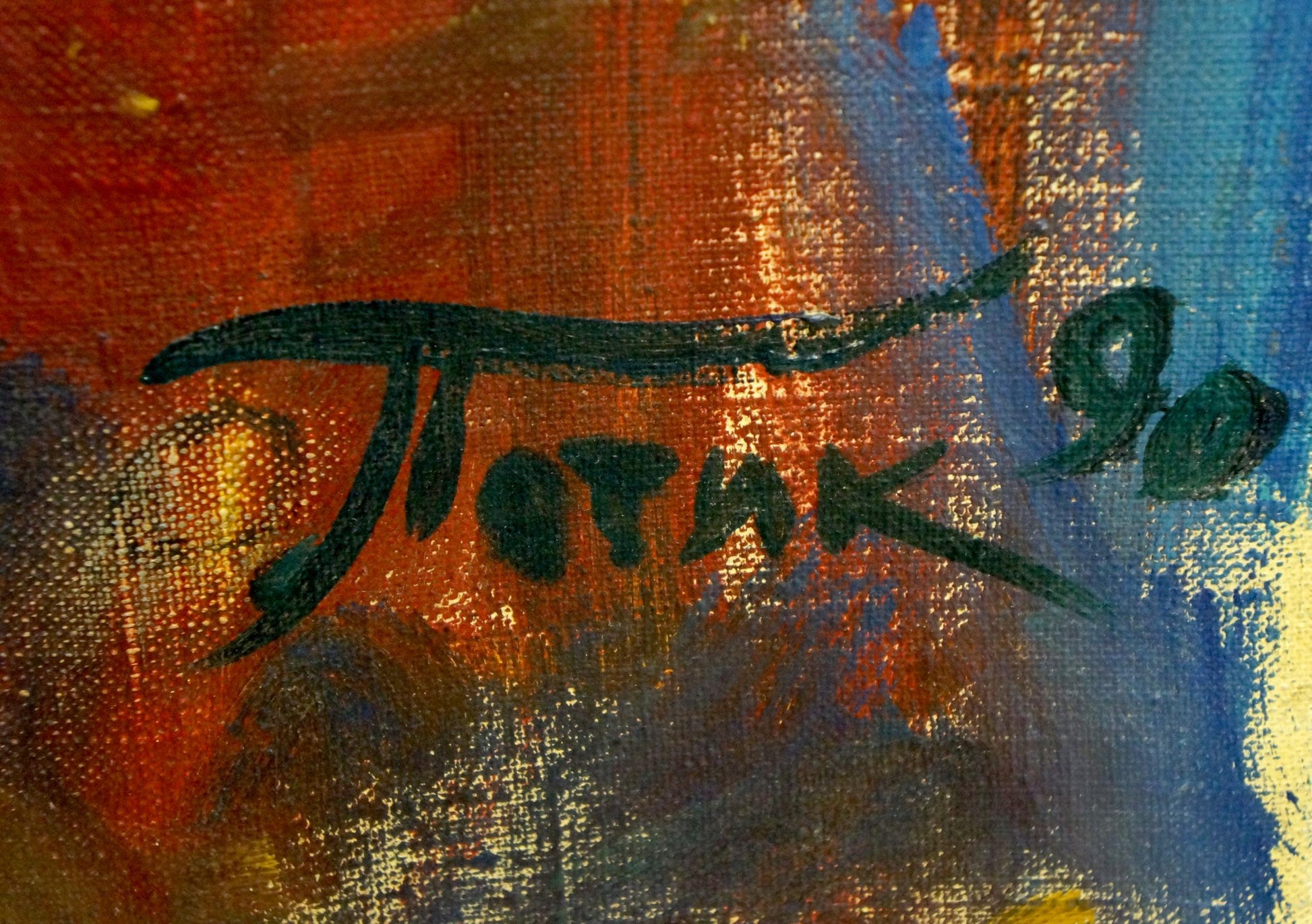 Dark green cursive signature on orange blue textured canvas by Patik Volodymyr Yosypovych