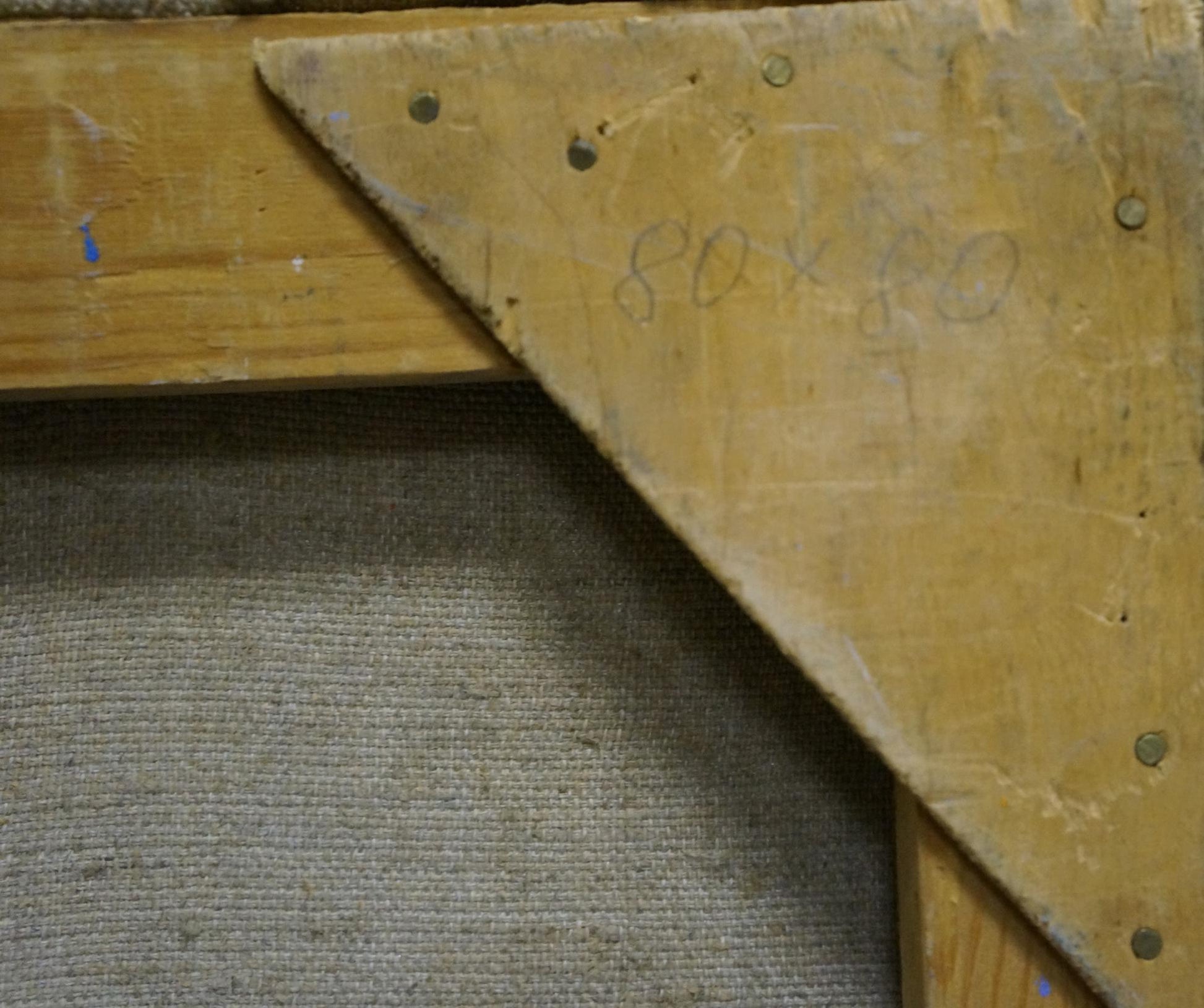 Back of oil painting Sunflowers by Kolomoitsev Petr Mikhailovich with worn wooden triangular support bracket, visible screws and faded pencil markings