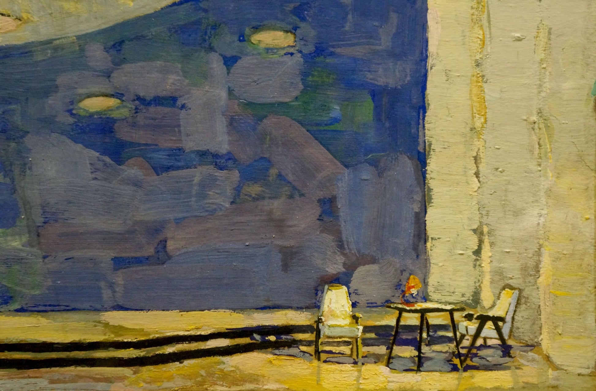 Impressionistic pastel painting by Alexander Deineka of warmly lit table and chairs