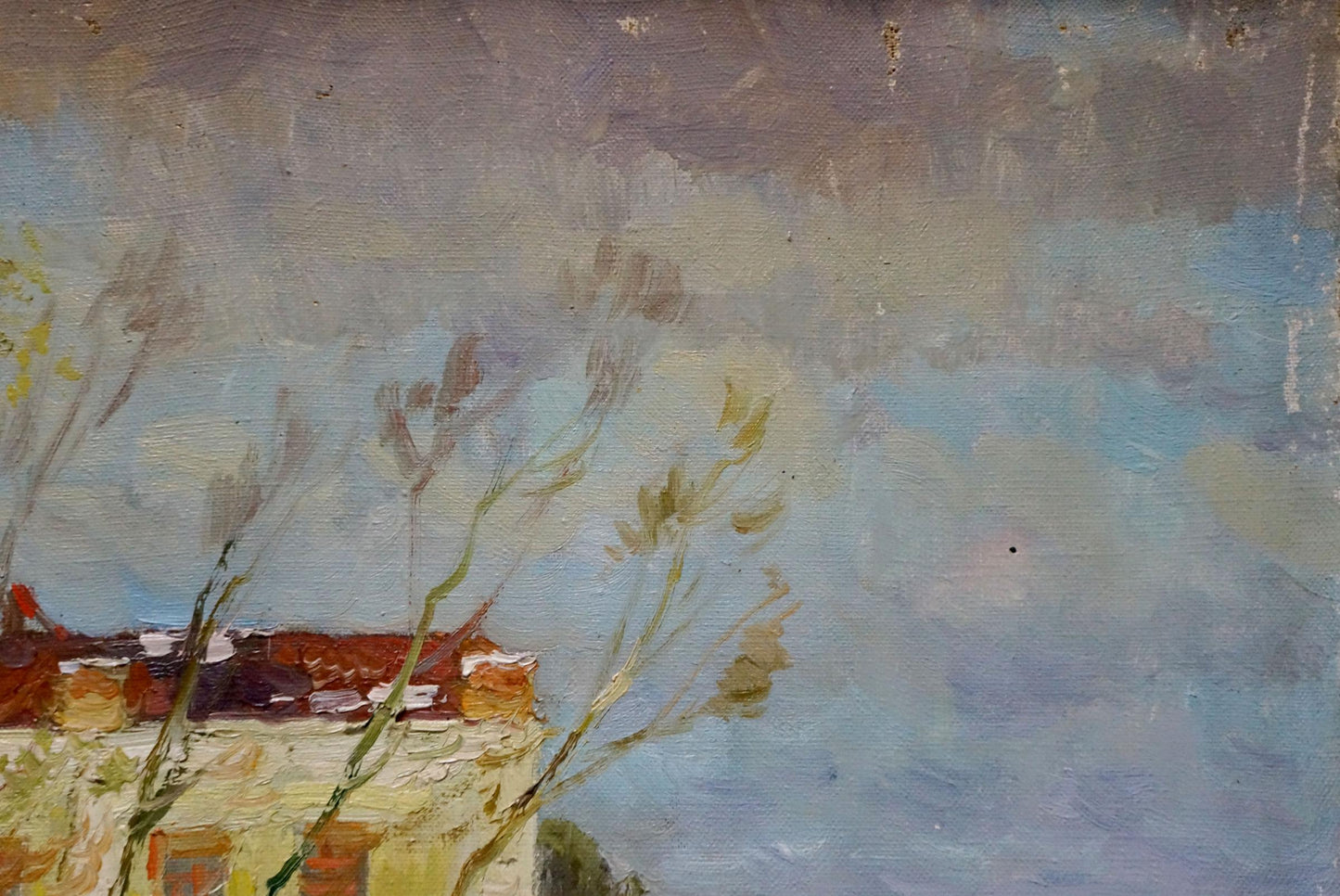 A textured oil painting depicting a rustic building with red-tiled roofs and bare tree branches against a soft, cloudy sky.