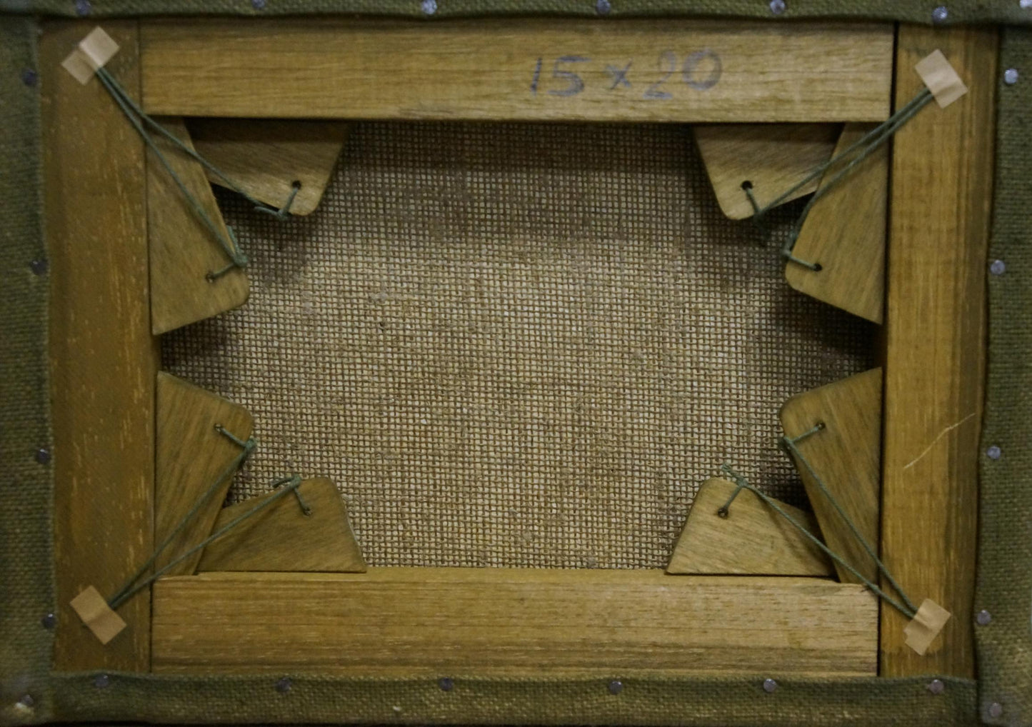 Back of oil painting Boat on frozen river on wooden stretcher with burlap panel