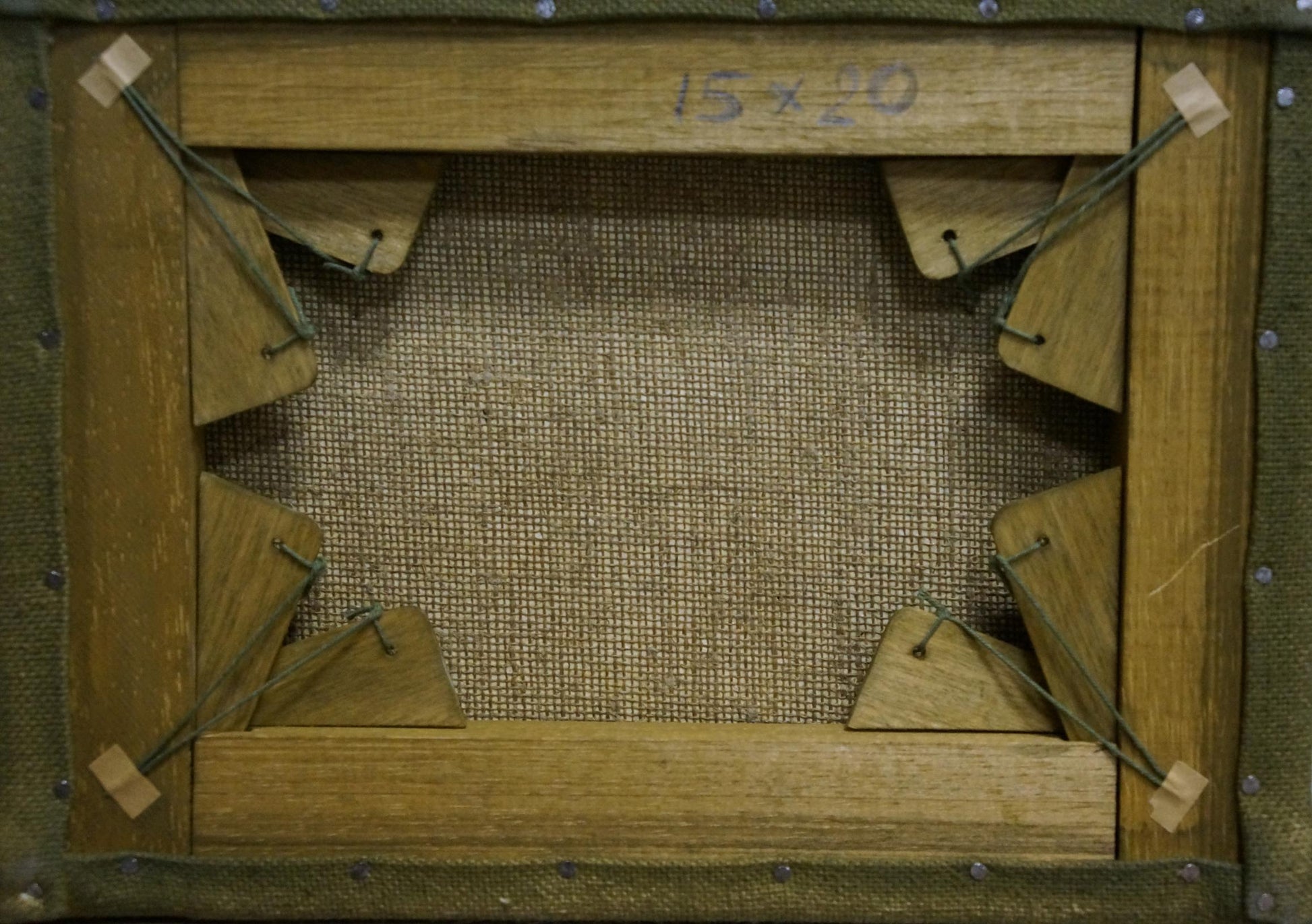 Back of oil painting Boat on frozen river on wooden stretcher with burlap panel