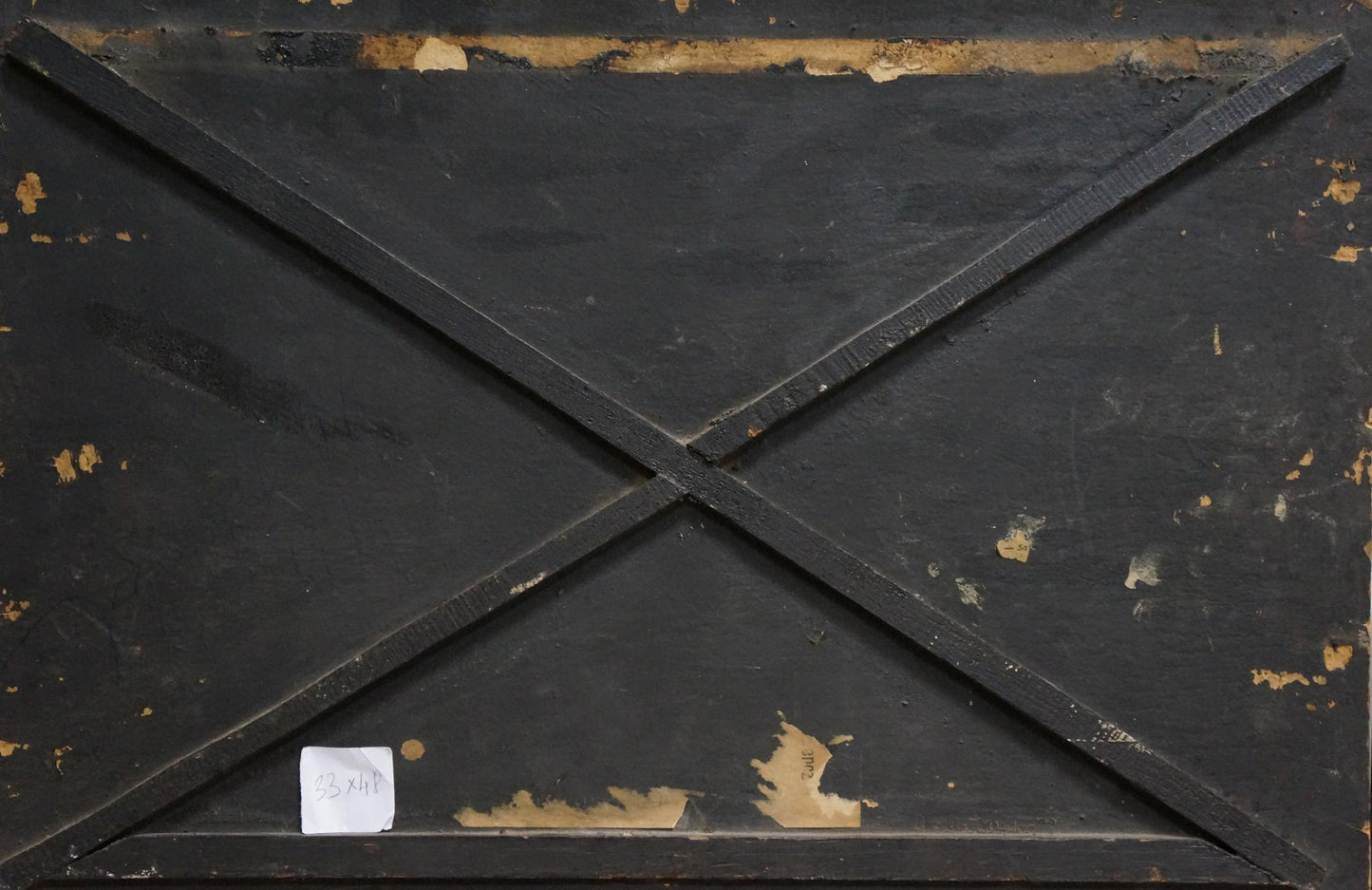 Back of oil painting Horse on the field: black wooden panel with diagonal braces and peeling gold paint