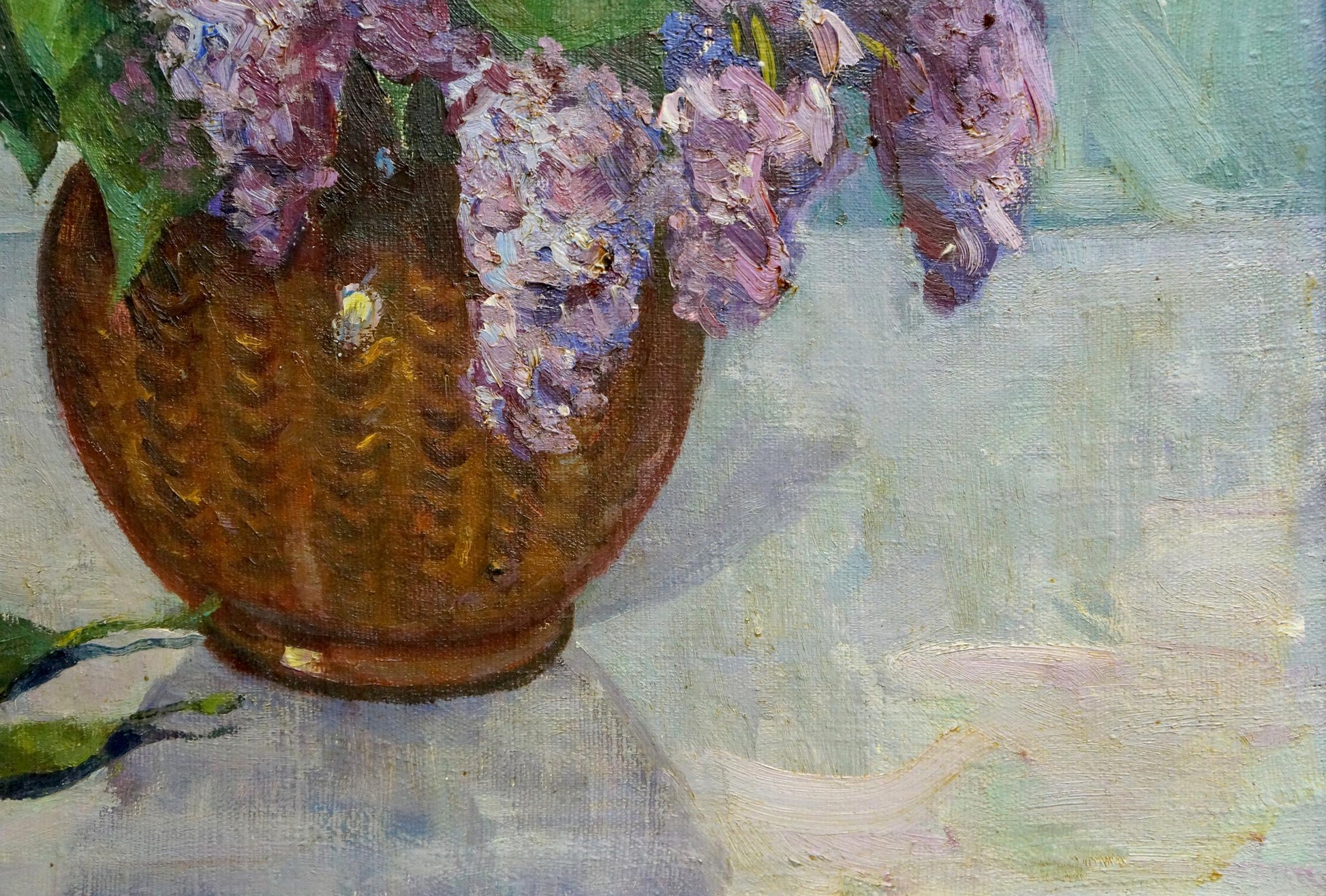 Oil painting of lilacs and tulips in textured golden-brown ceramic vase