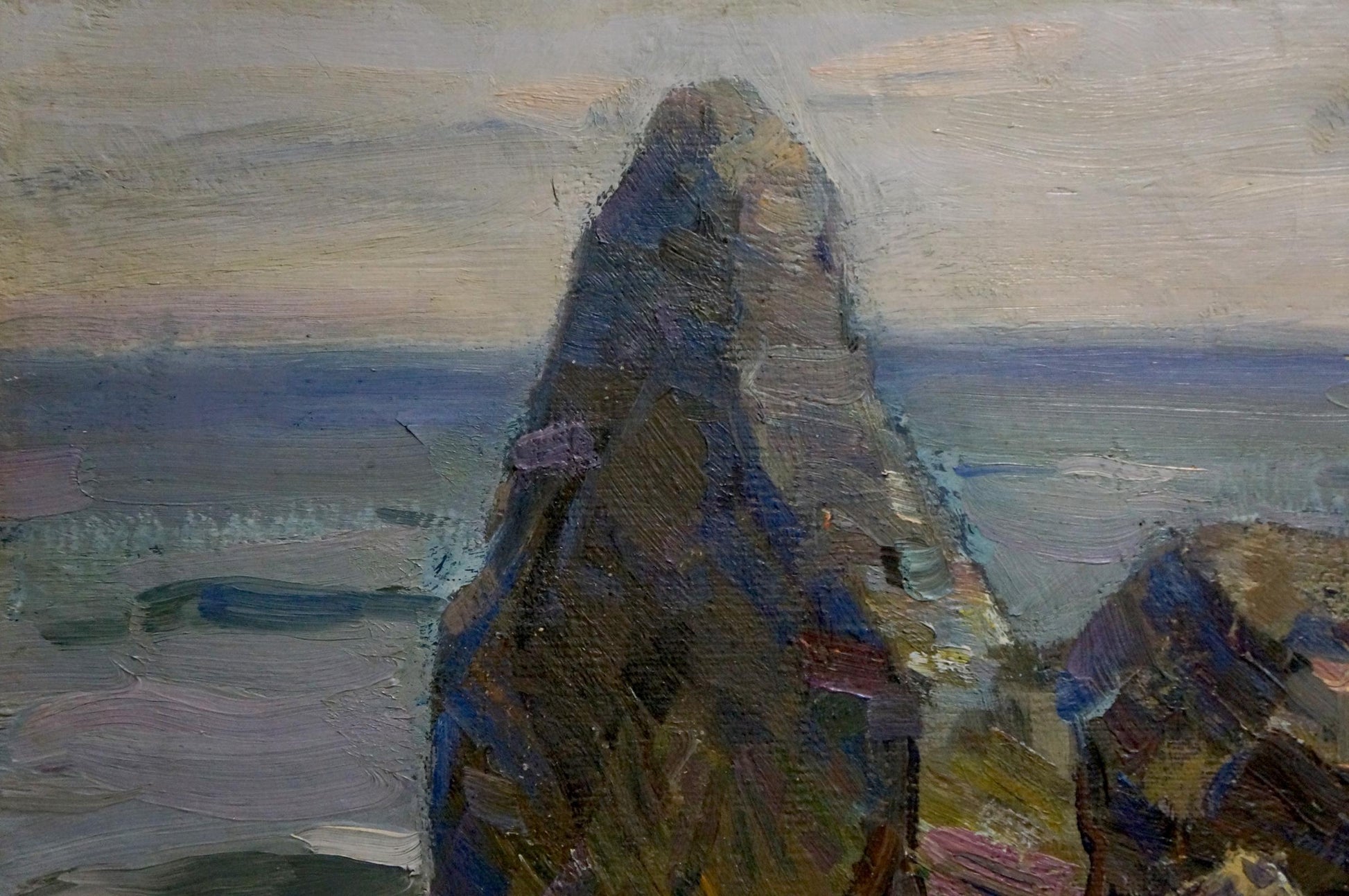Oil painting Near the sea by Strelov Arkady Efimovich: textured gray-blue rock formation against muted sky