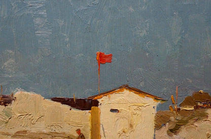 Vibrant red flag flutters atop weathered white building by Sulimenko Petr Stepanovich