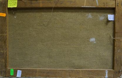 Back of framed Oil painting Stones by the sea with beige textured canvas on rustic wood