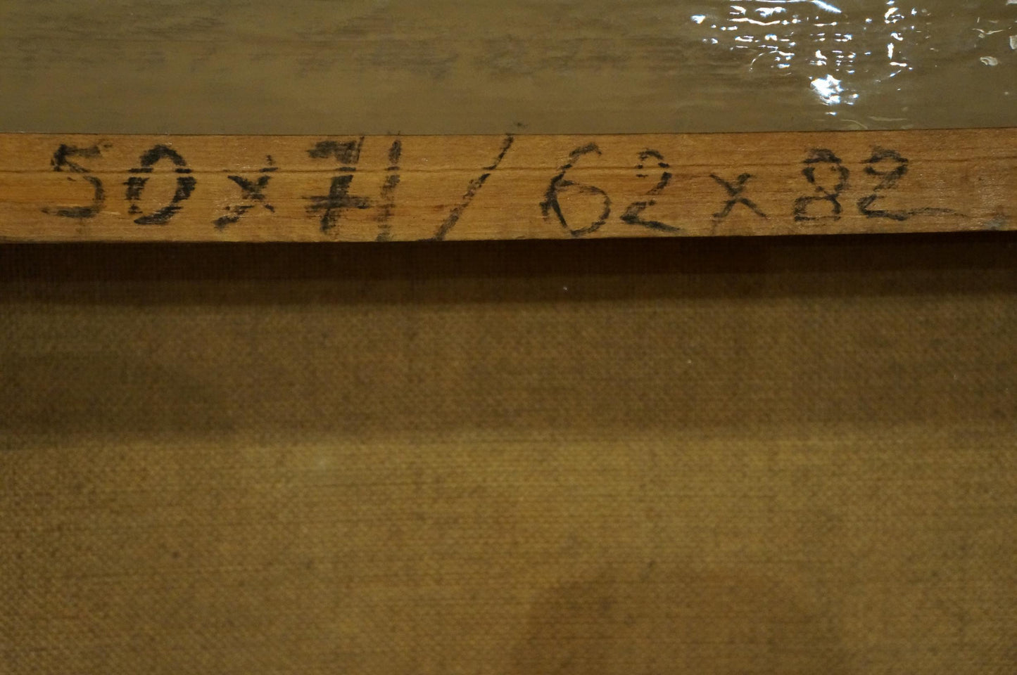 Back of Oil painting City life landscape: light brown wooden ruler marked 50 x 71 / 62 x 82