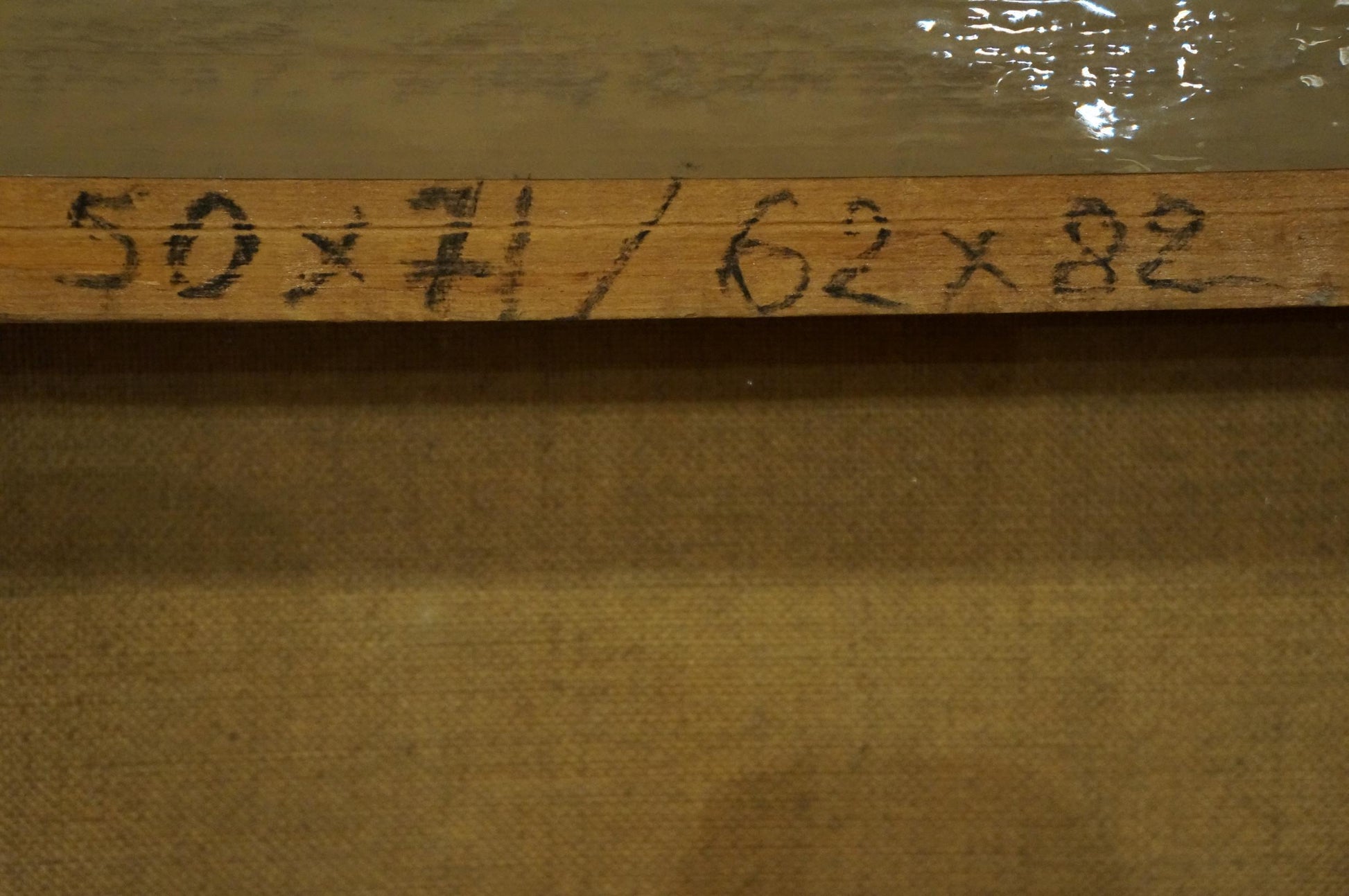 Back of Oil painting City life landscape: light brown wooden ruler marked 50 x 71 / 62 x 82