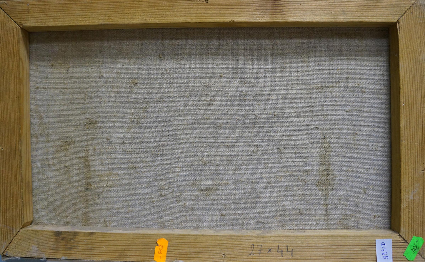 The back of a rectangular canvas painting with a light brown wooden frame and a textured, off-white fabric backing.