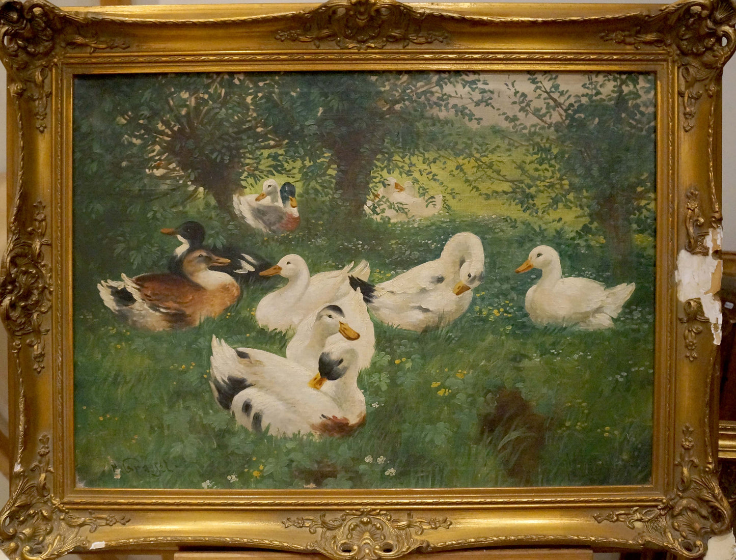 Ornate gold-framed oil painting of geese in lush field by H. Graesel