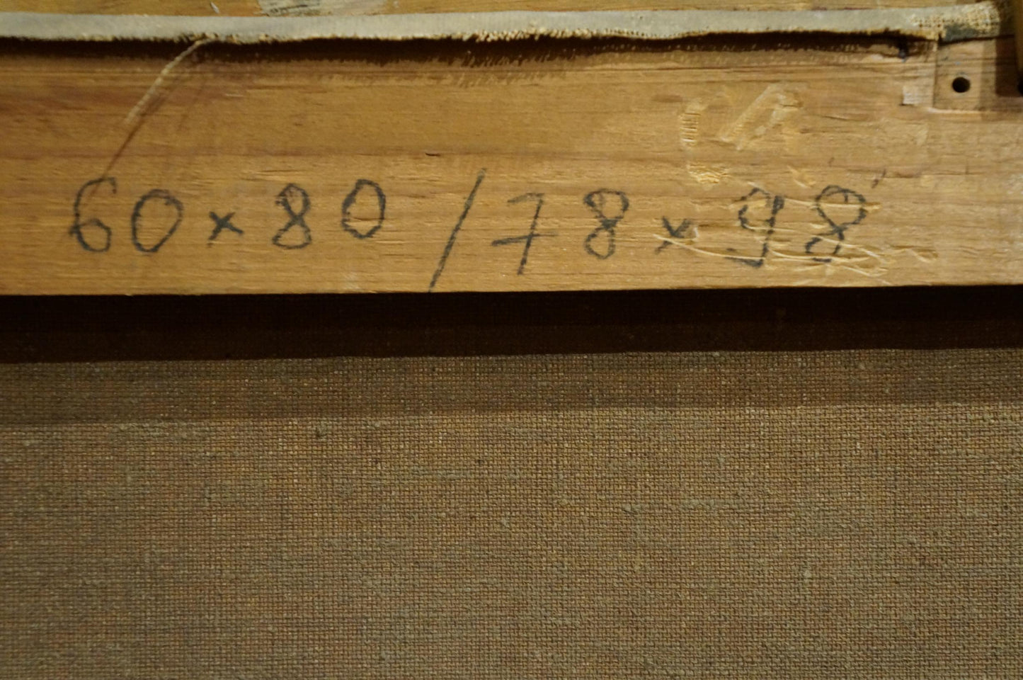 Back of Oil painting Friends gathered canvas with wooden stretcher bar and handwritten dimensions in black ink
