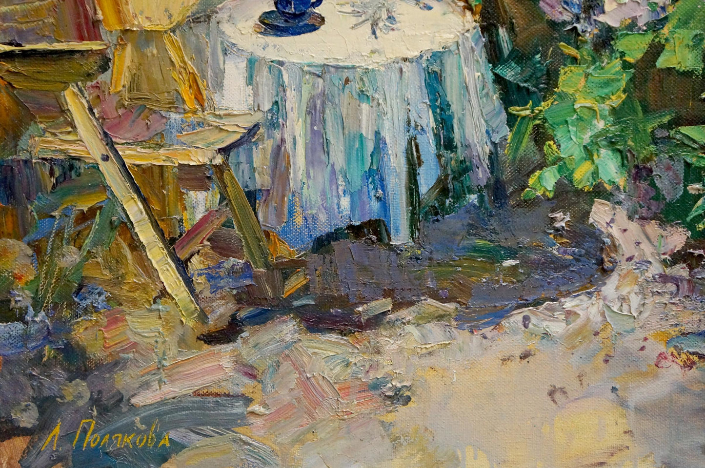 Oil painting of lilac blooms by Polyakova Lyudmila Valentinovna on blue tablecloth