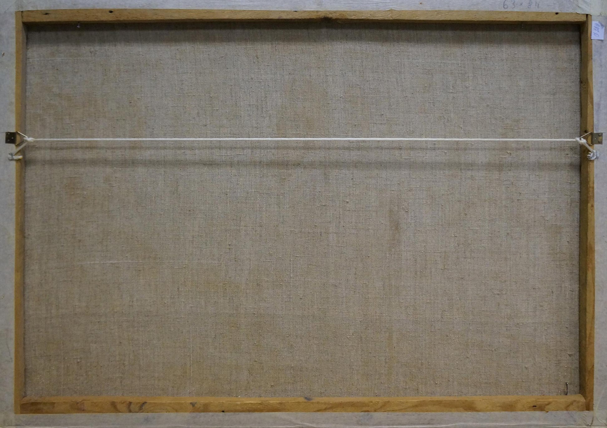 Back of Abstract oil painting Behind the Wheel by Kachanov Konstantin Silovich, beige canvas on light wood frame