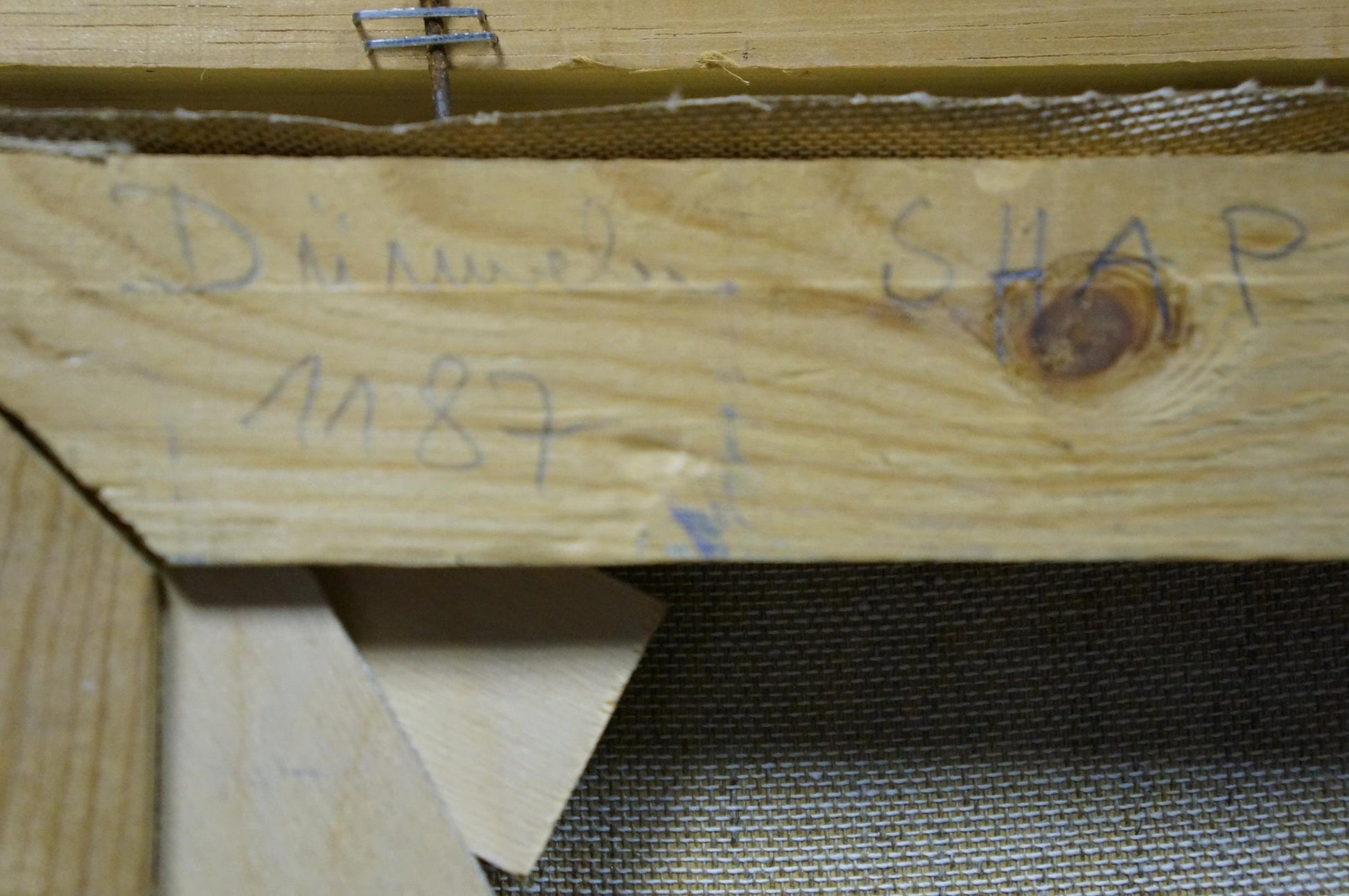 Back of oil painting canvas stretcher bar with wood grain and markings