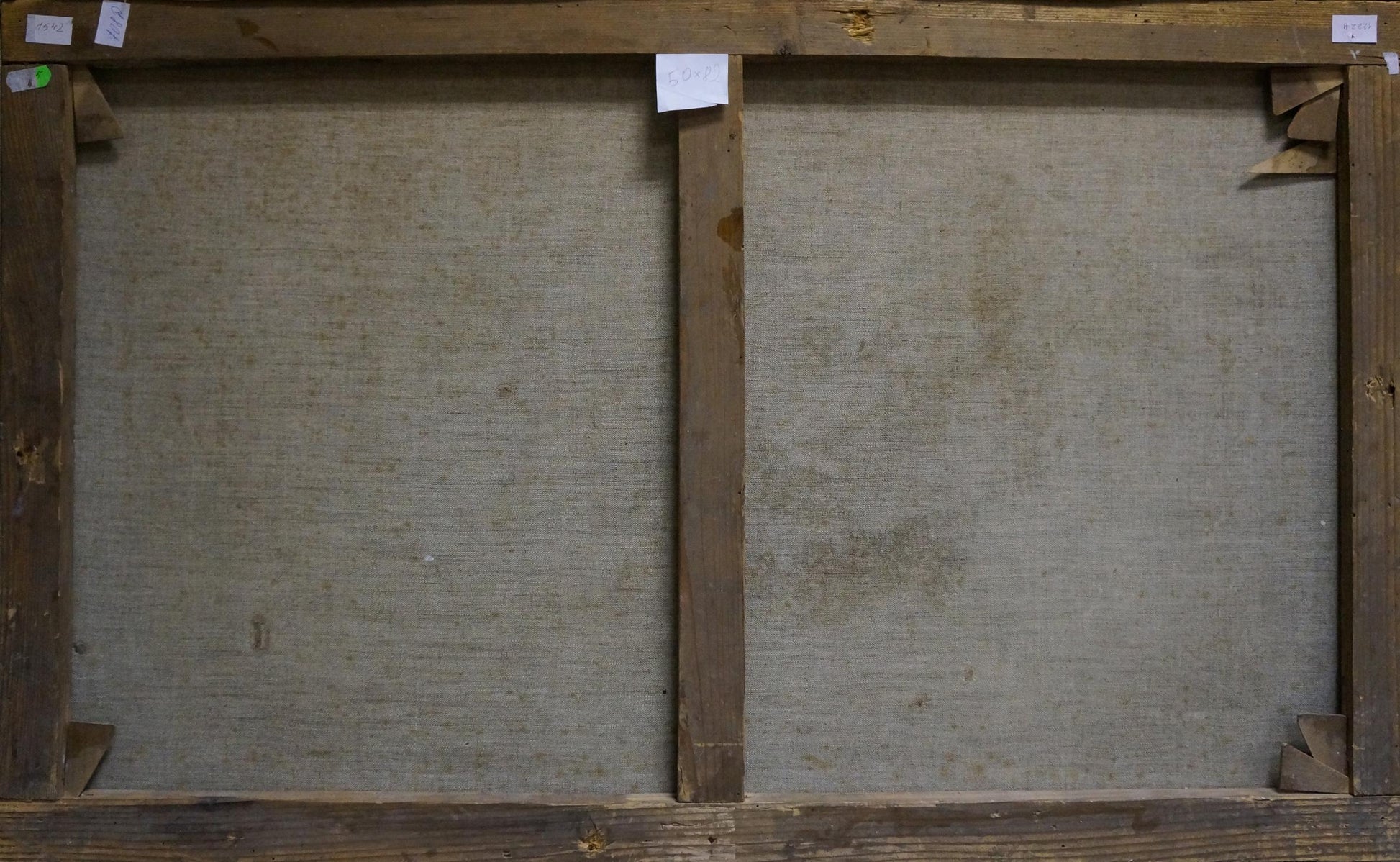 Back view of two-panel wooden-framed canvas with gray textured fabric, Ship at sea oil painting