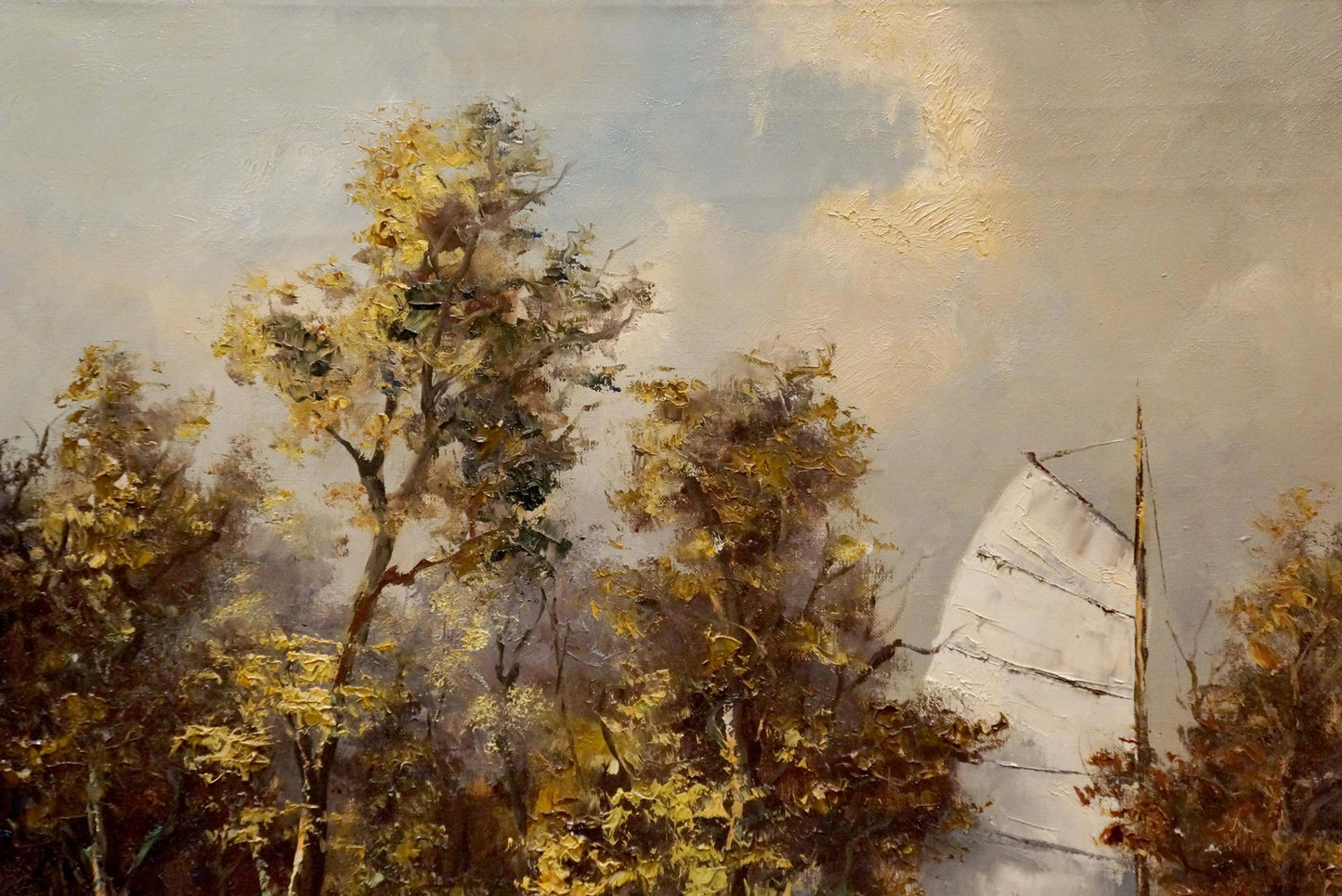 Oil painting of sailboat near shore with white sails, golden trees, cloudy sky