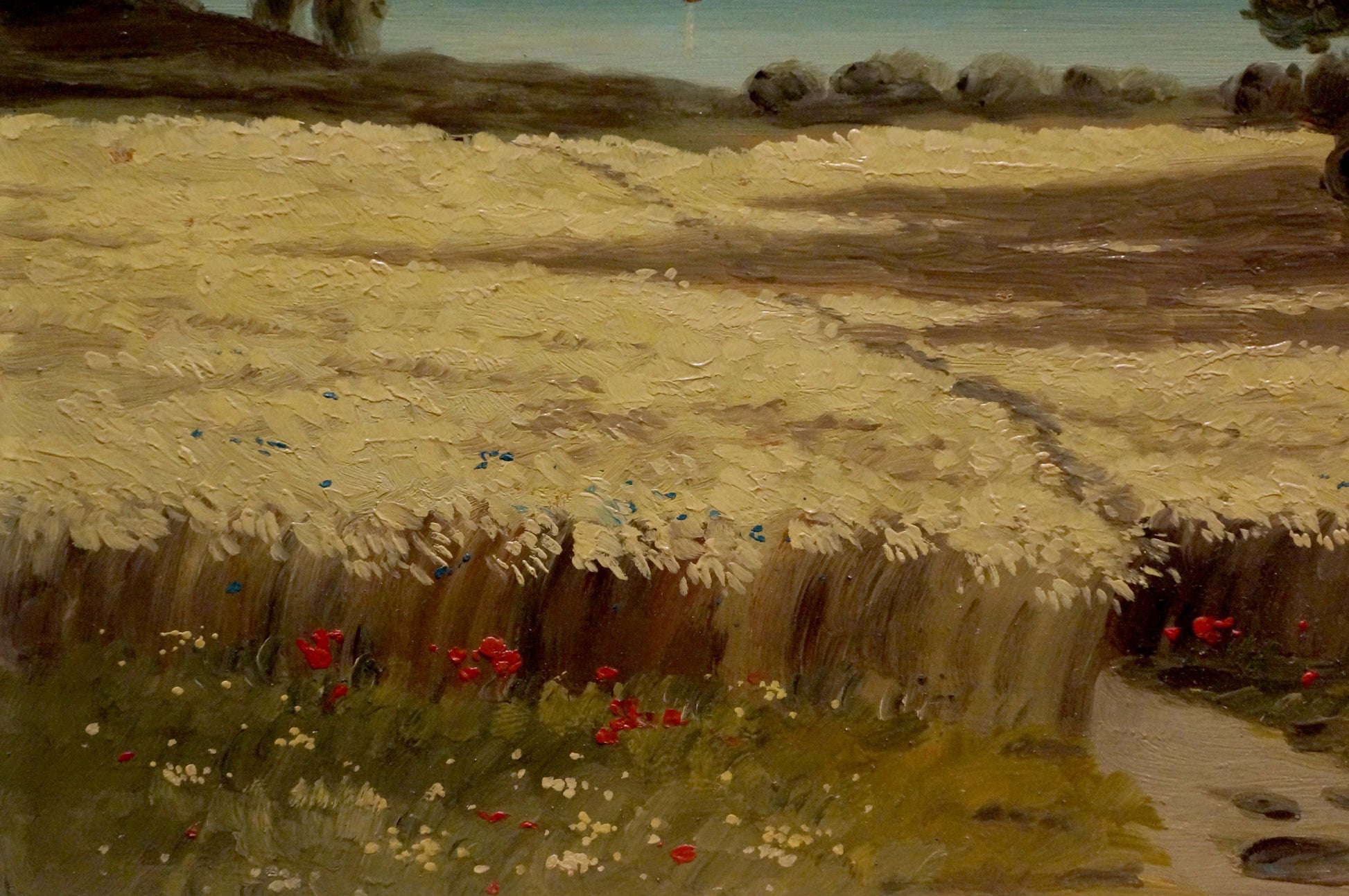 Oil painting of golden hay field with red poppies under blue sky