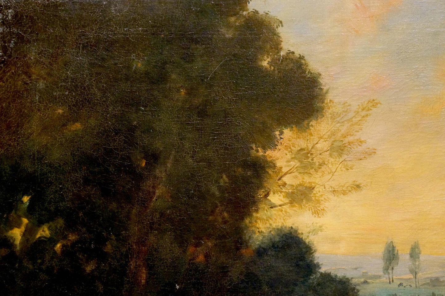 Oil painting of lush green tree against golden sky in picnic scene