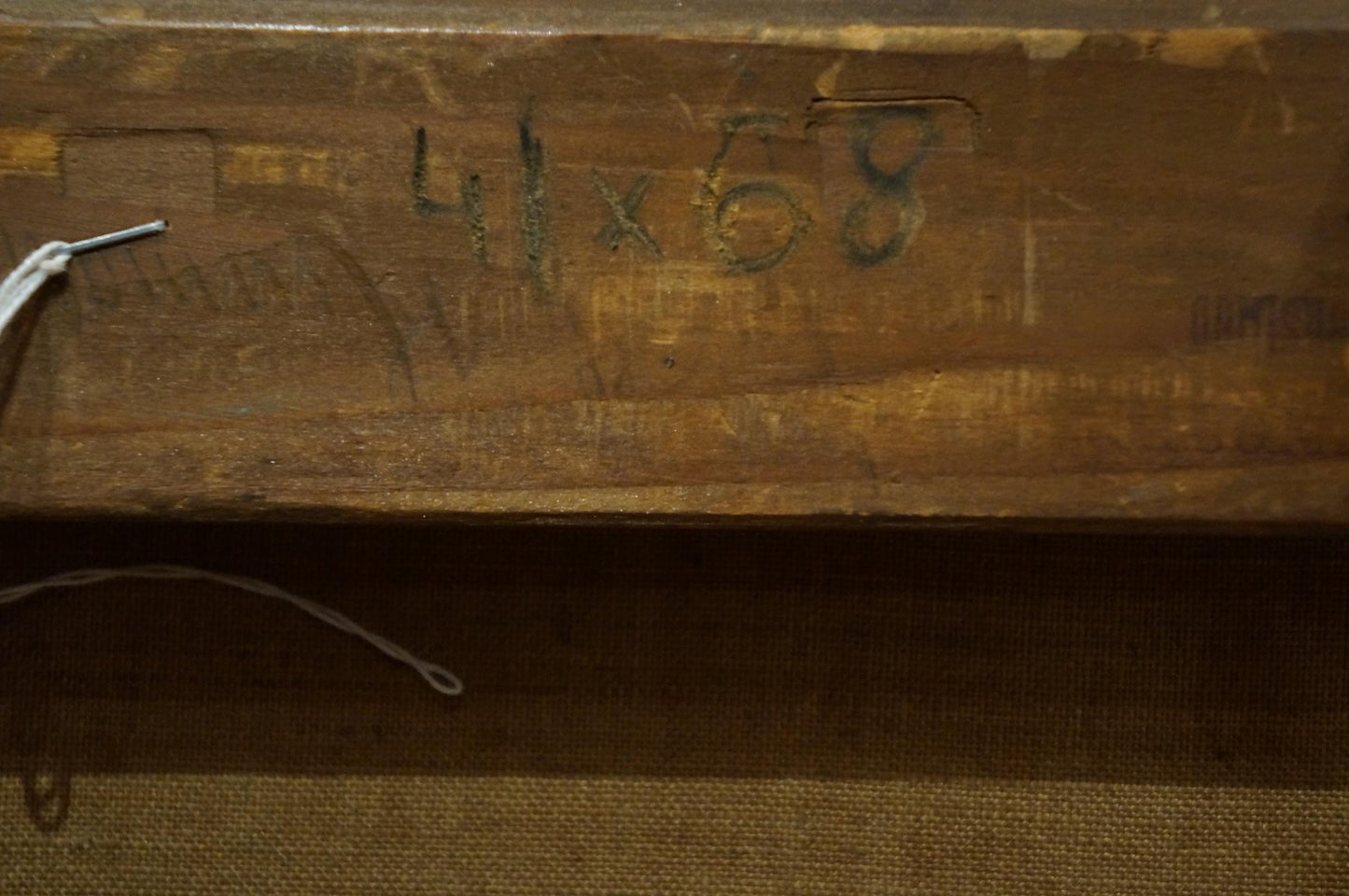 Back of oil painting Freshness after the rain: worn wooden stretcher bar with faded green dimension markings