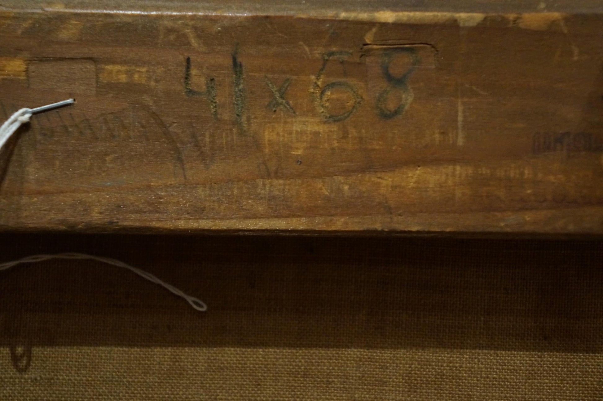 Back of oil painting Freshness after the rain: worn wooden stretcher bar with faded green dimension markings