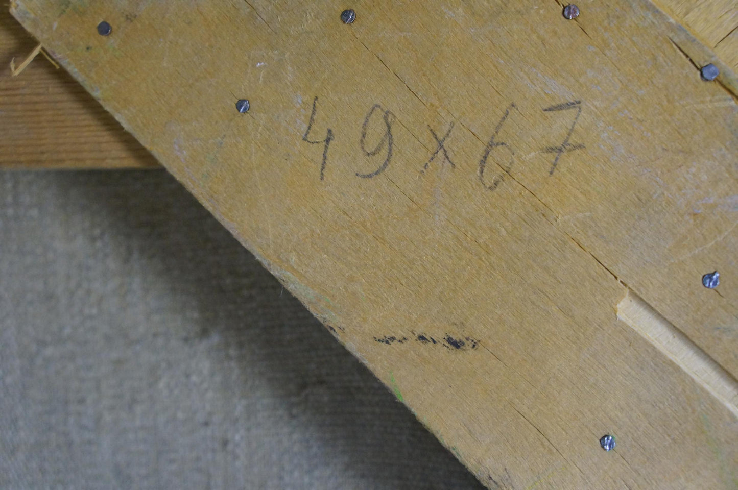Back of Volobuev Evgeny Vsevolodovich oil painting: weathered yellow plank with screws