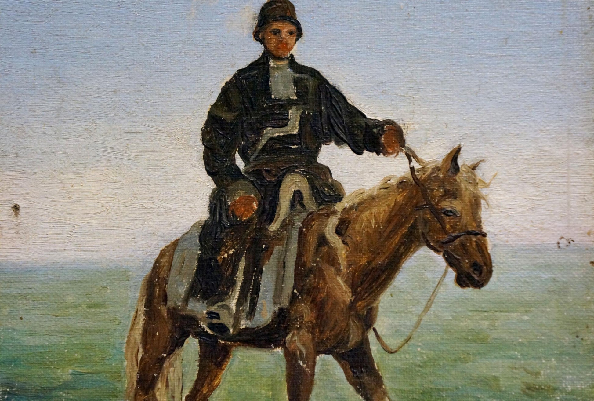 Rustic oil painting of man in dark attire on brown horse with white markings