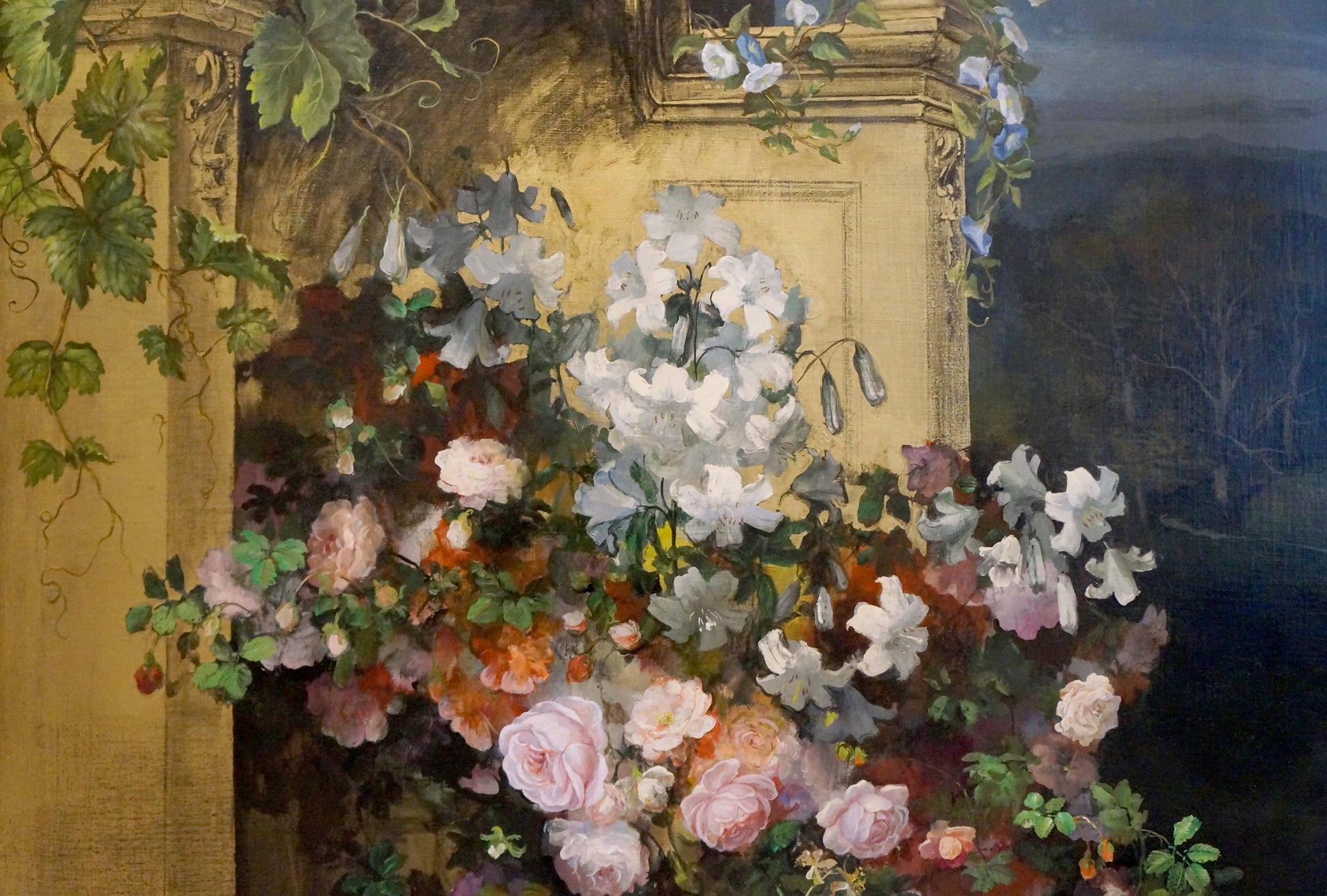 Oil painting of lush flowers on balcony in stone archway with roses and vines