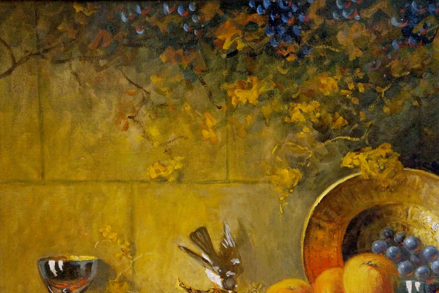Oil painting still life with grapes: golden bowl of purple grapes and orange fruits on yellow surface