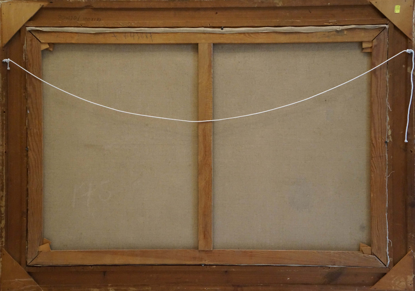 Back of oil painting Still life with grapes on light brown wooden frame with crossbar