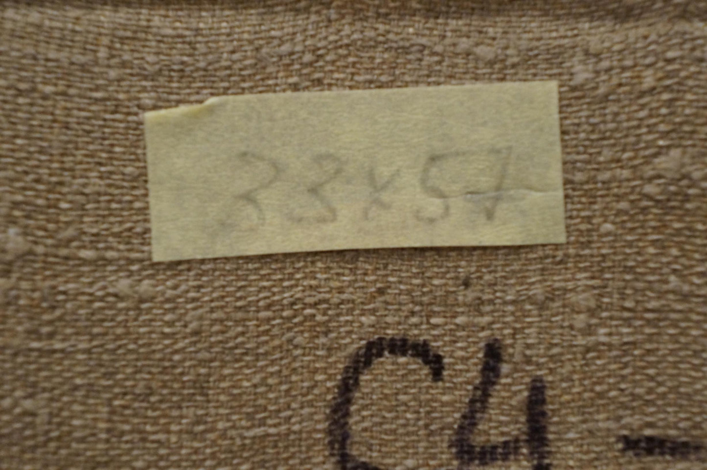 Back of Nikolay Vladimirovich Chernikov winter oil painting with beige textured fabric and torn label
