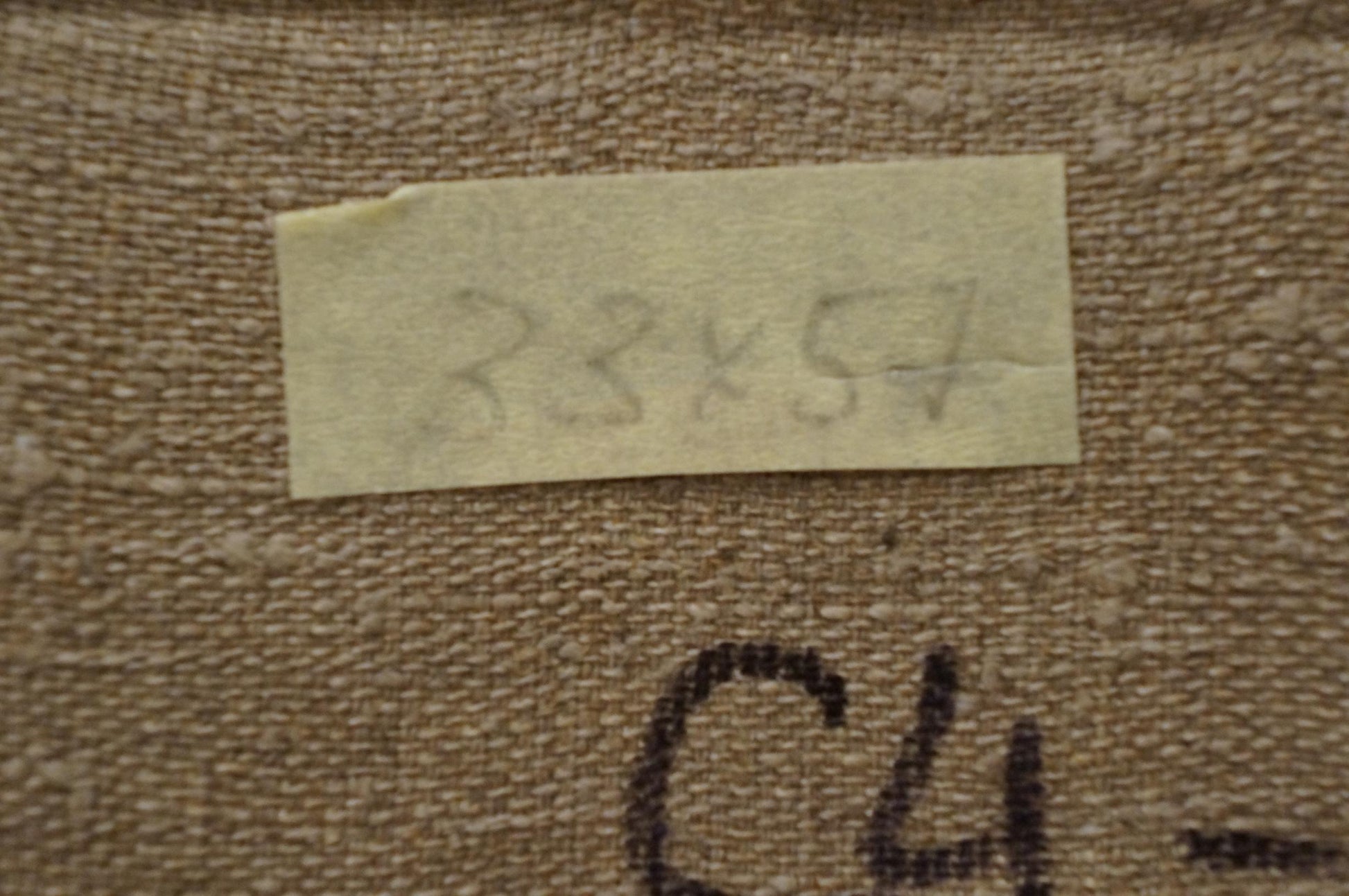 Back of Nikolay Vladimirovich Chernikov winter oil painting with beige textured fabric and torn label