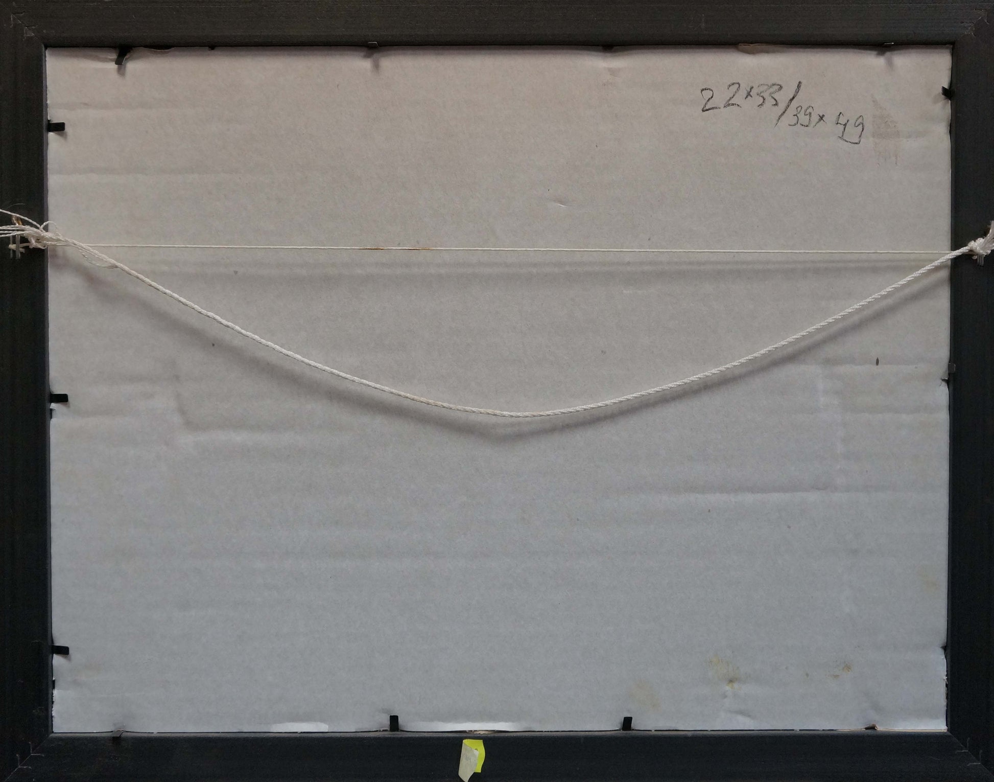 Back of Oil painting In the village with black frame, white backing, thin off-white string
