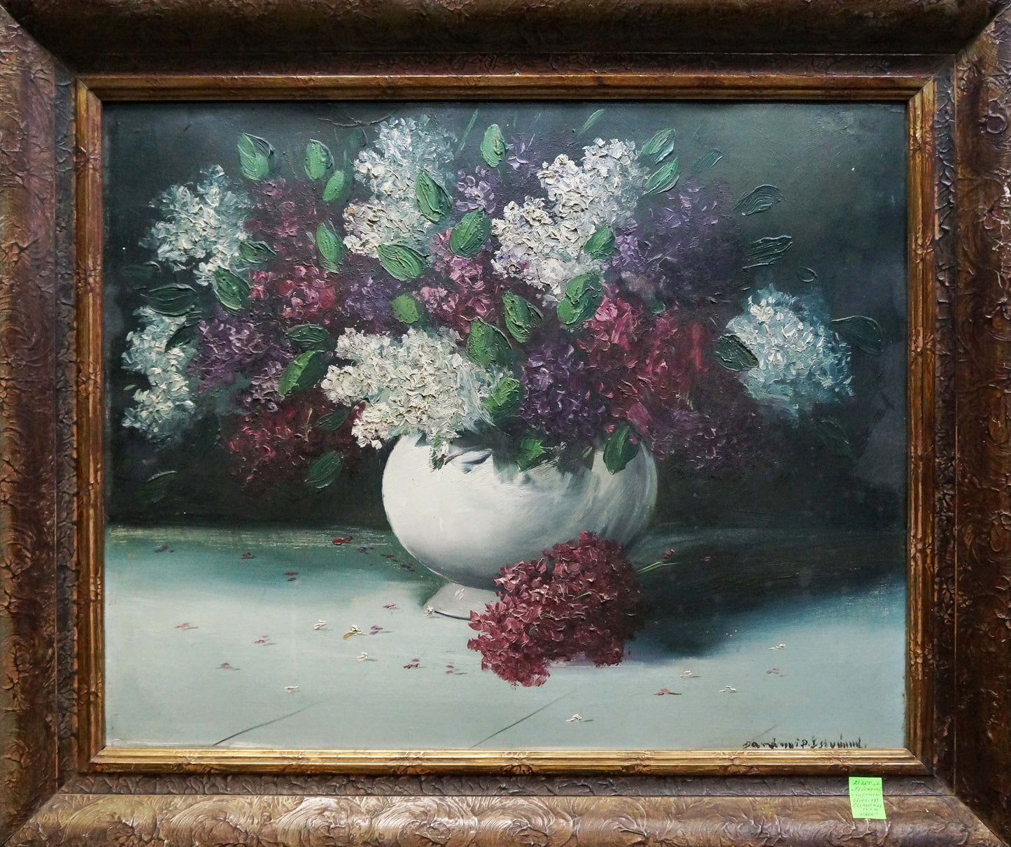 Oil painting of still life with lilacs: white vase of purple and white lilacs on dark background
