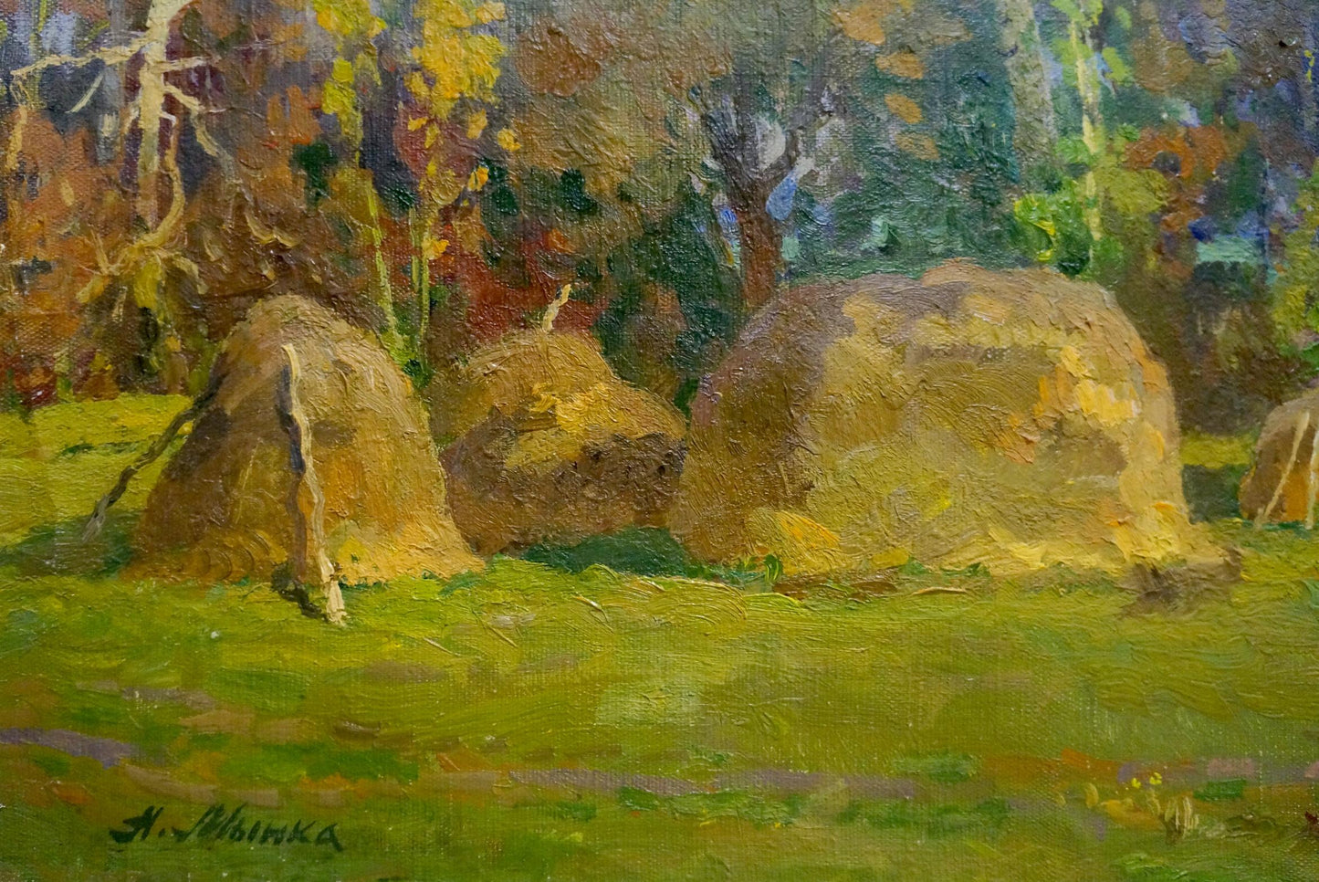 Oil painting Last autumn harvest by Alexander Mynka: golden hay bales in field