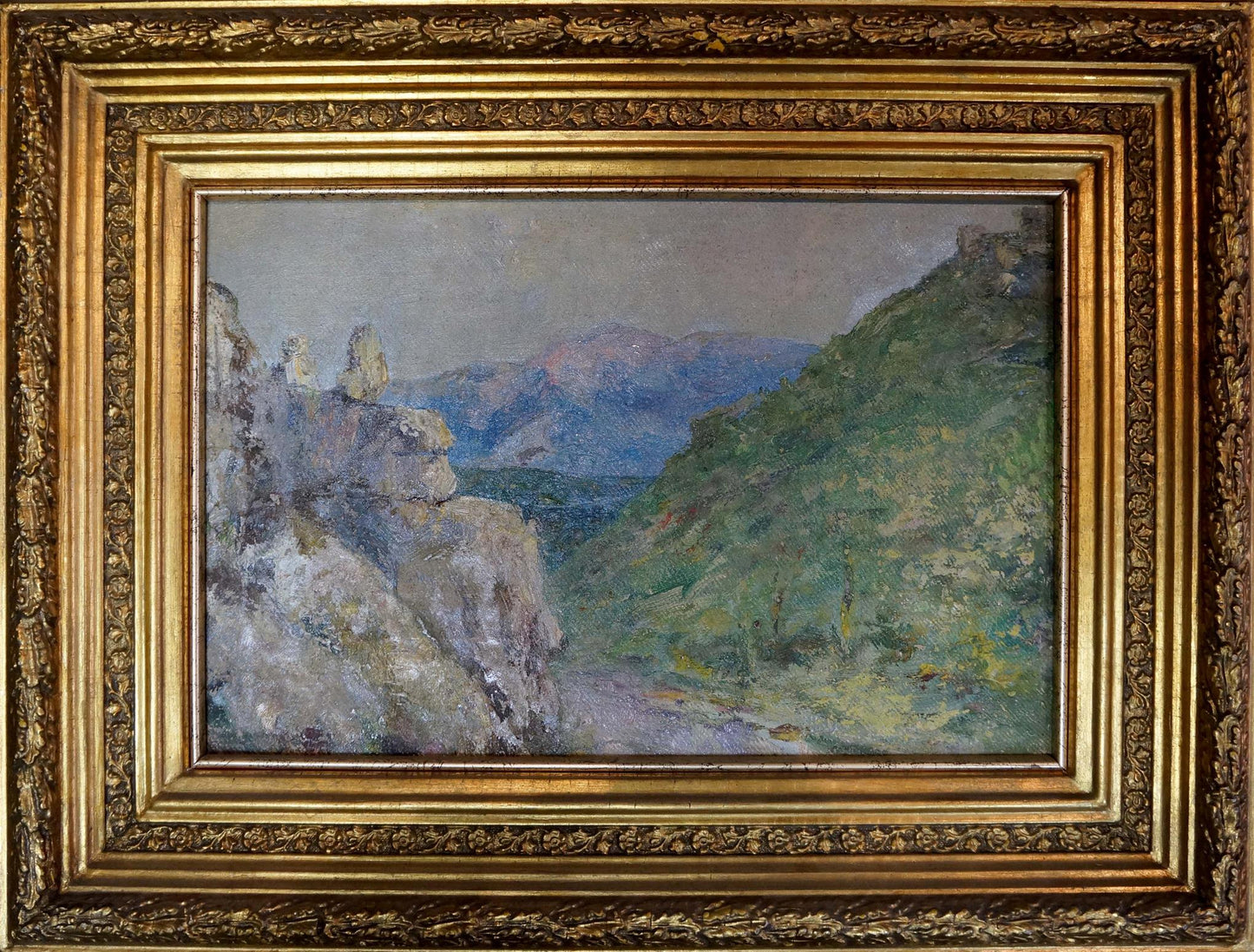 Ornate gold-framed oil painting of mountain landscape by Paul Christiaan Bos