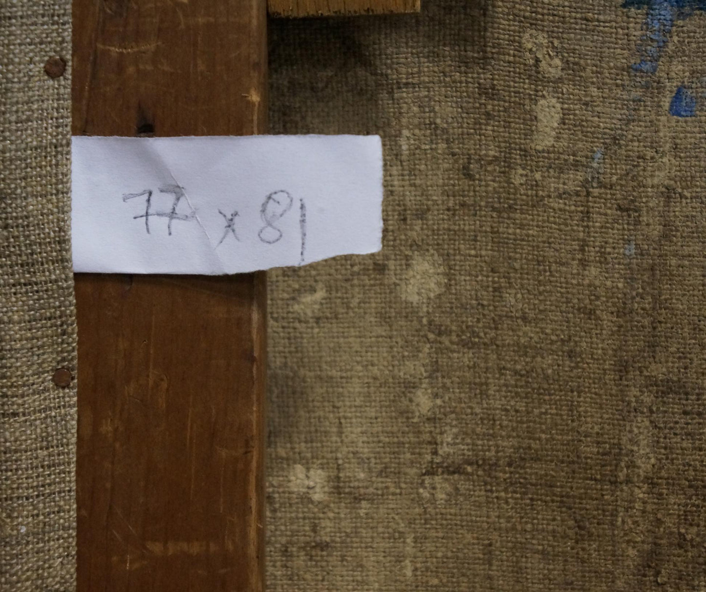 Back of Oil painting Autumn bouquet frame with 77 x 81 inch label