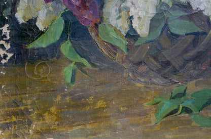 Oil painting of lilac flowers in woven brown basket with green leaves